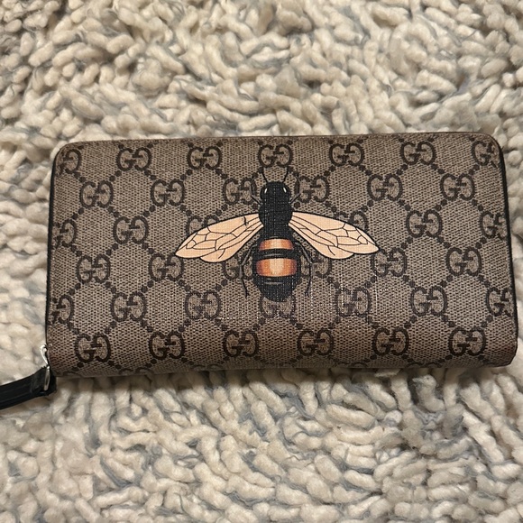 Gucci Handbags - GUCCI bee monogram wallet coated canvas zippy silver hardwares